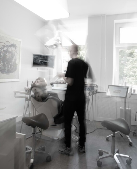 Modern Practice room with a dentis giving a patient a treatmenr